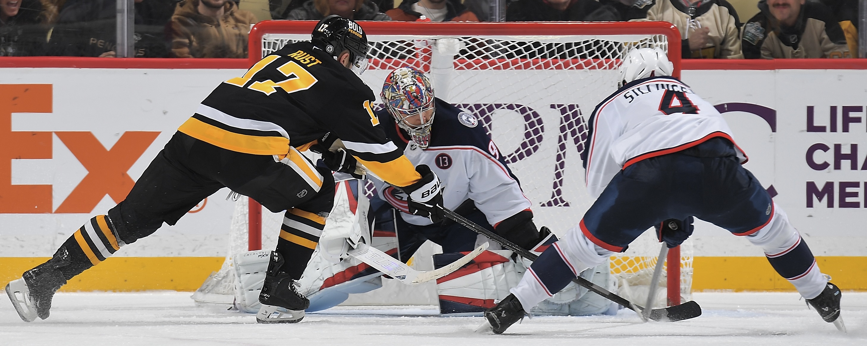 Bryan Rust can't beat the Blue Jackets' Elvis Merzlikins or Cole Sillinger on this forehand wrap attempt Tuesday night at PPG Paints Arena.