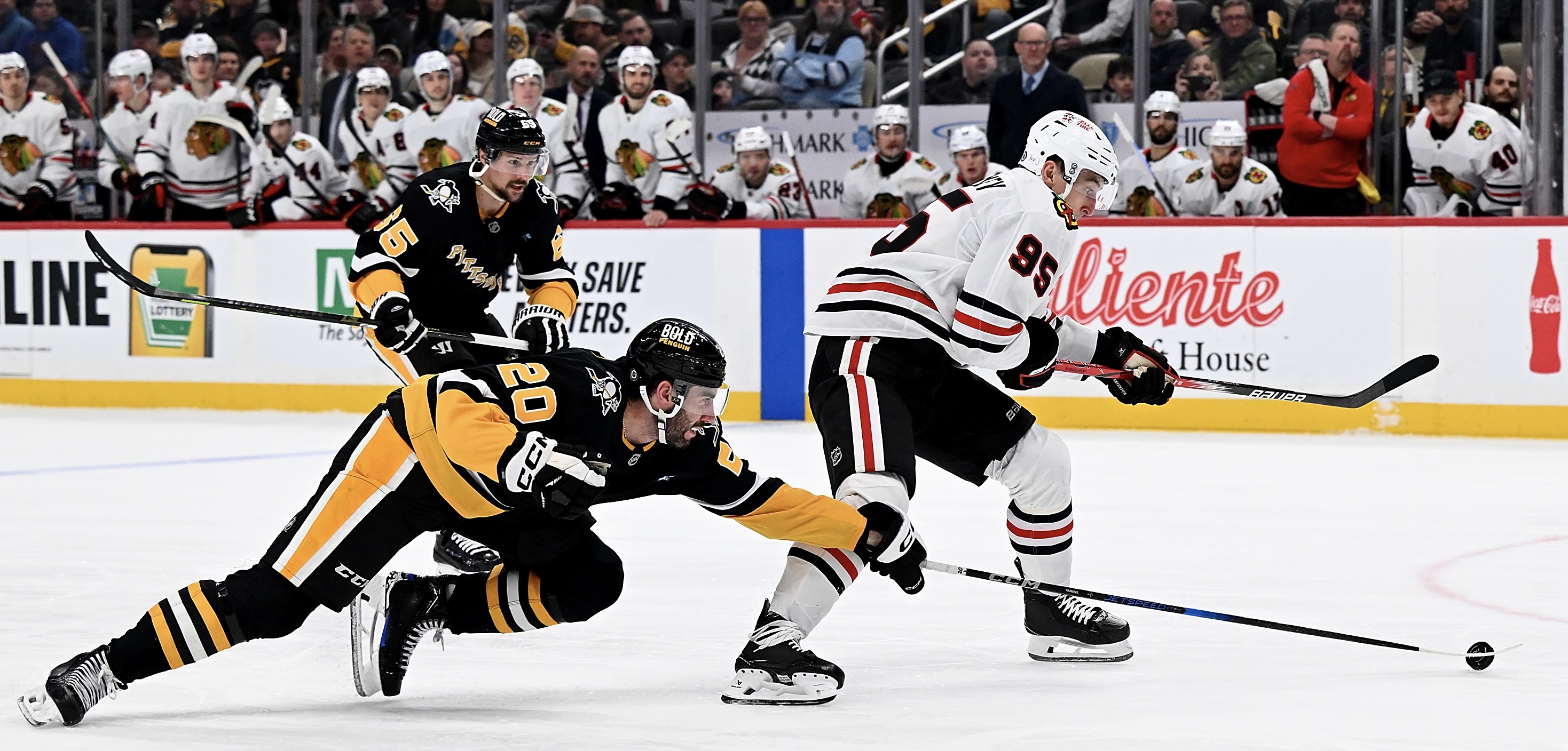 Conor Timmins dives to pokecheck the Blackhawks' Ilya Mikheyev on a partial break in the second period Tuesday night at PPG Paints Arena.