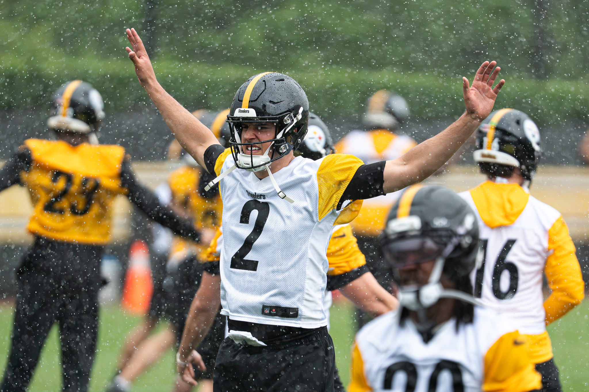 Mason Rudolph gestures as the rain picks up early in the OTA session Wednesday.