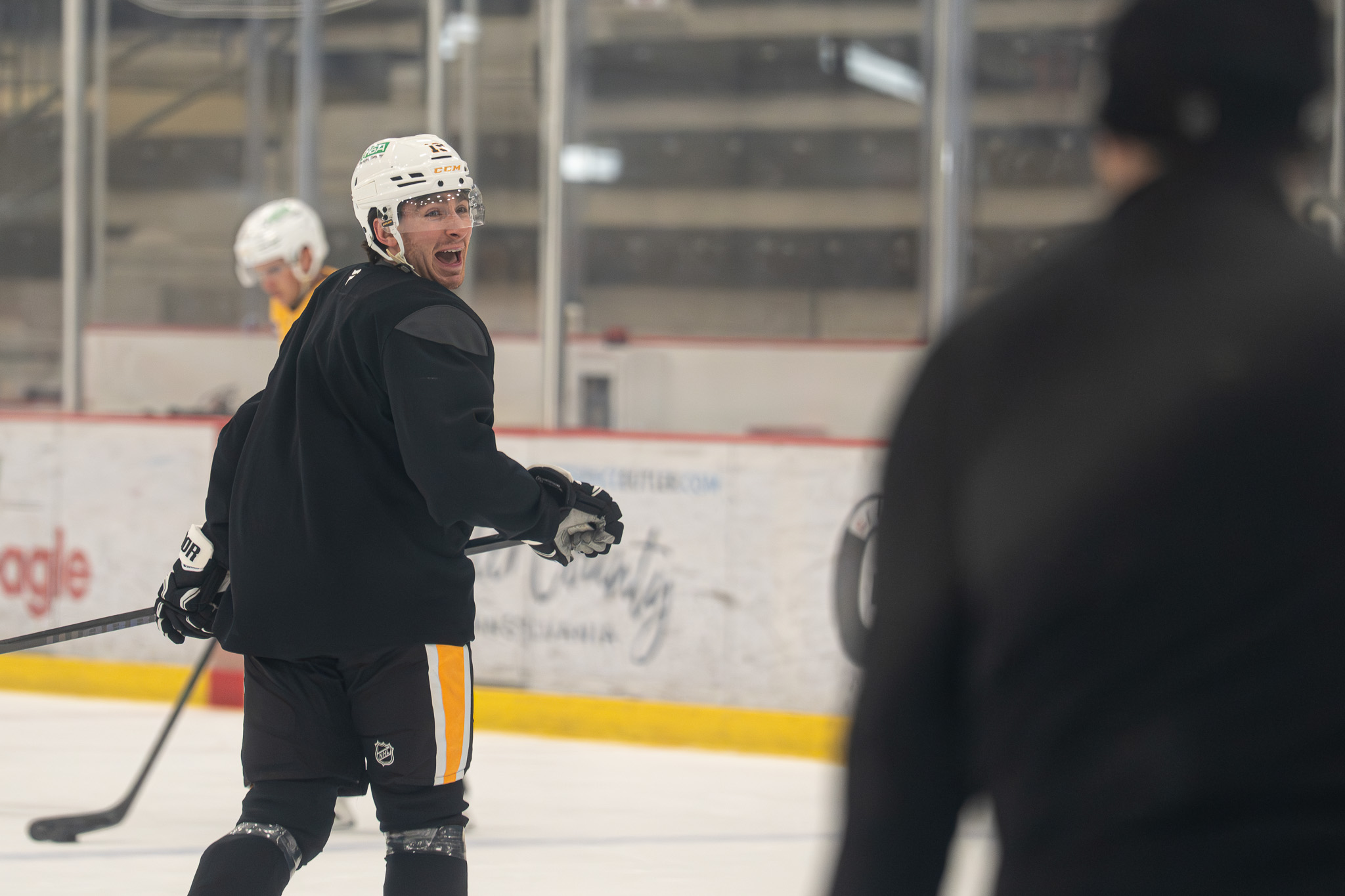 Connor Dewar smiles back toward the net.
