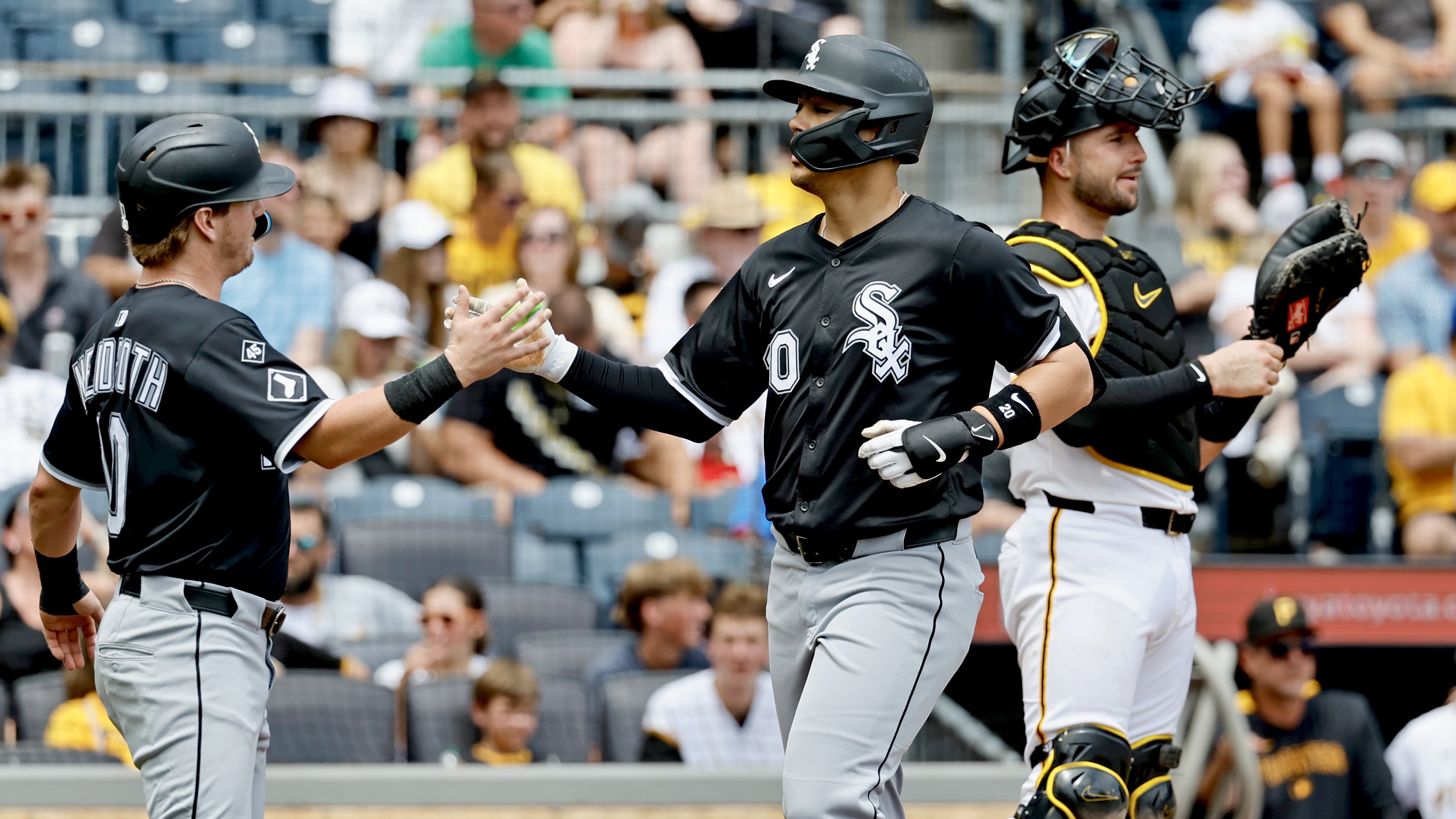 Miguel Vargas celebrates his three-run home run with White Sox teammate Chase Meidroth in the first inning Sunday at PNC Park.