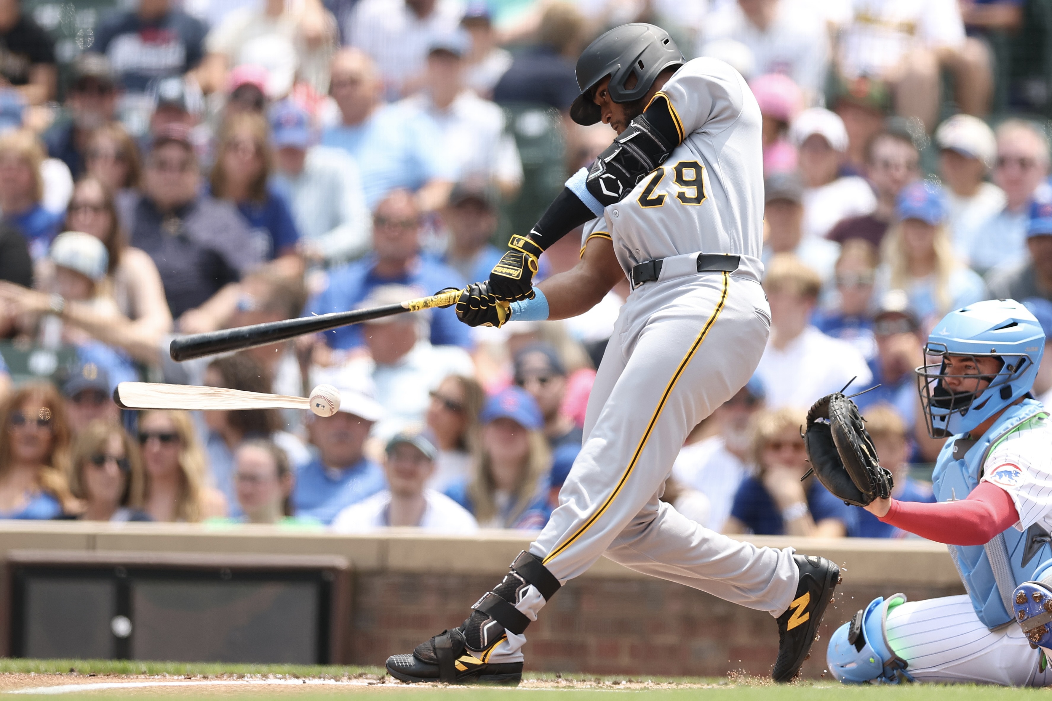 Alexander Canario splinters his bat against the Cubs on Sunday at Wrigley Field.