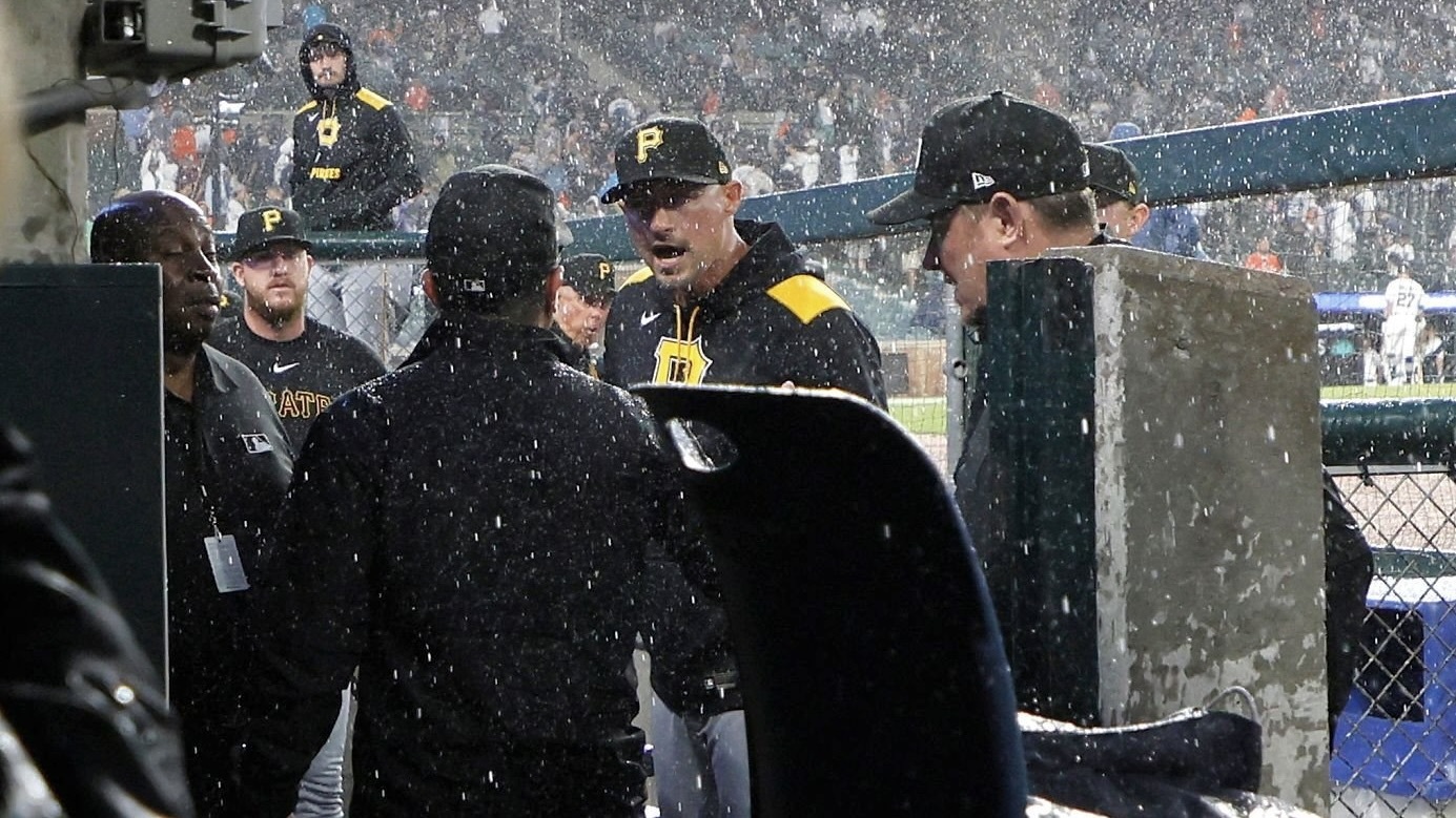Don Kelly shouts at umpire crew chief Chris Guccione as they leave the field during a rain delay in the ninth inning tonight at Comerica Park.