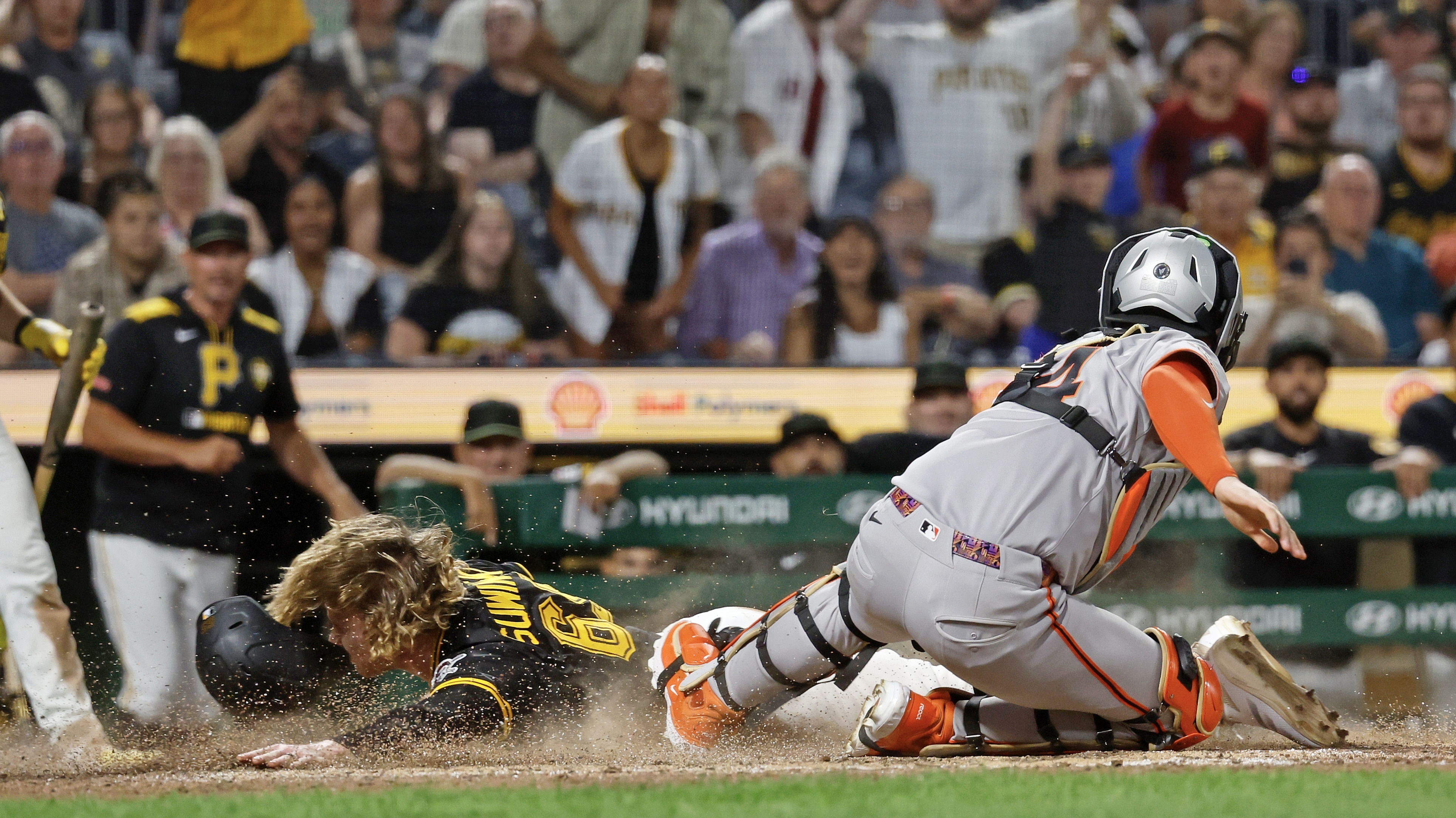 Jack Suwinski's slide beats the tag of the Giants' Patrick Bailey to win the game in the ninth inning Monday night at PNC Park.