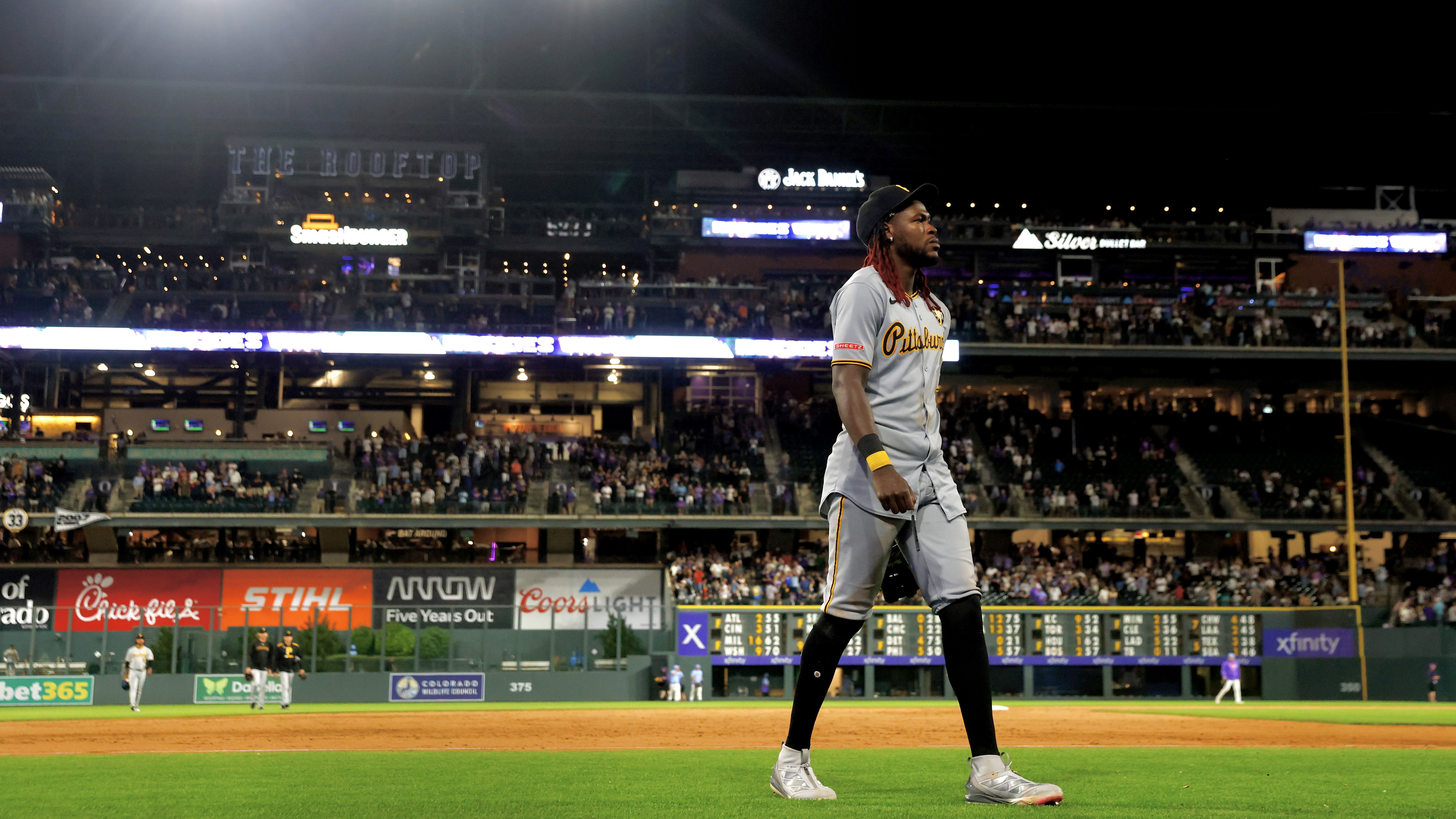 Oneil Cruz walks off Coors Field after the loss Friday night in Denver.