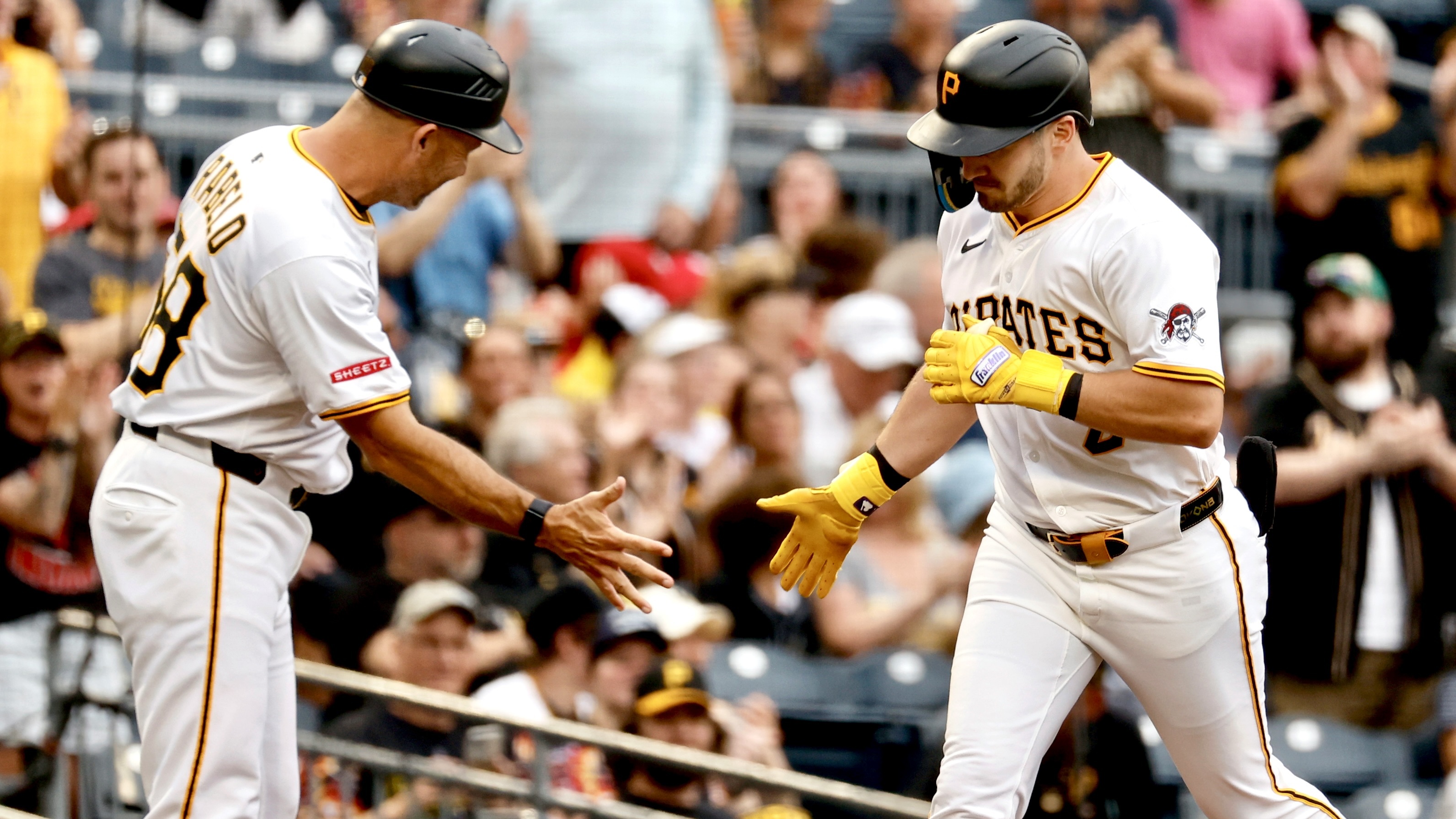 Spencer Horwitz celebrates his solo home run with third base coach Mike Rabelo in the first inning tonight at PNC Park.