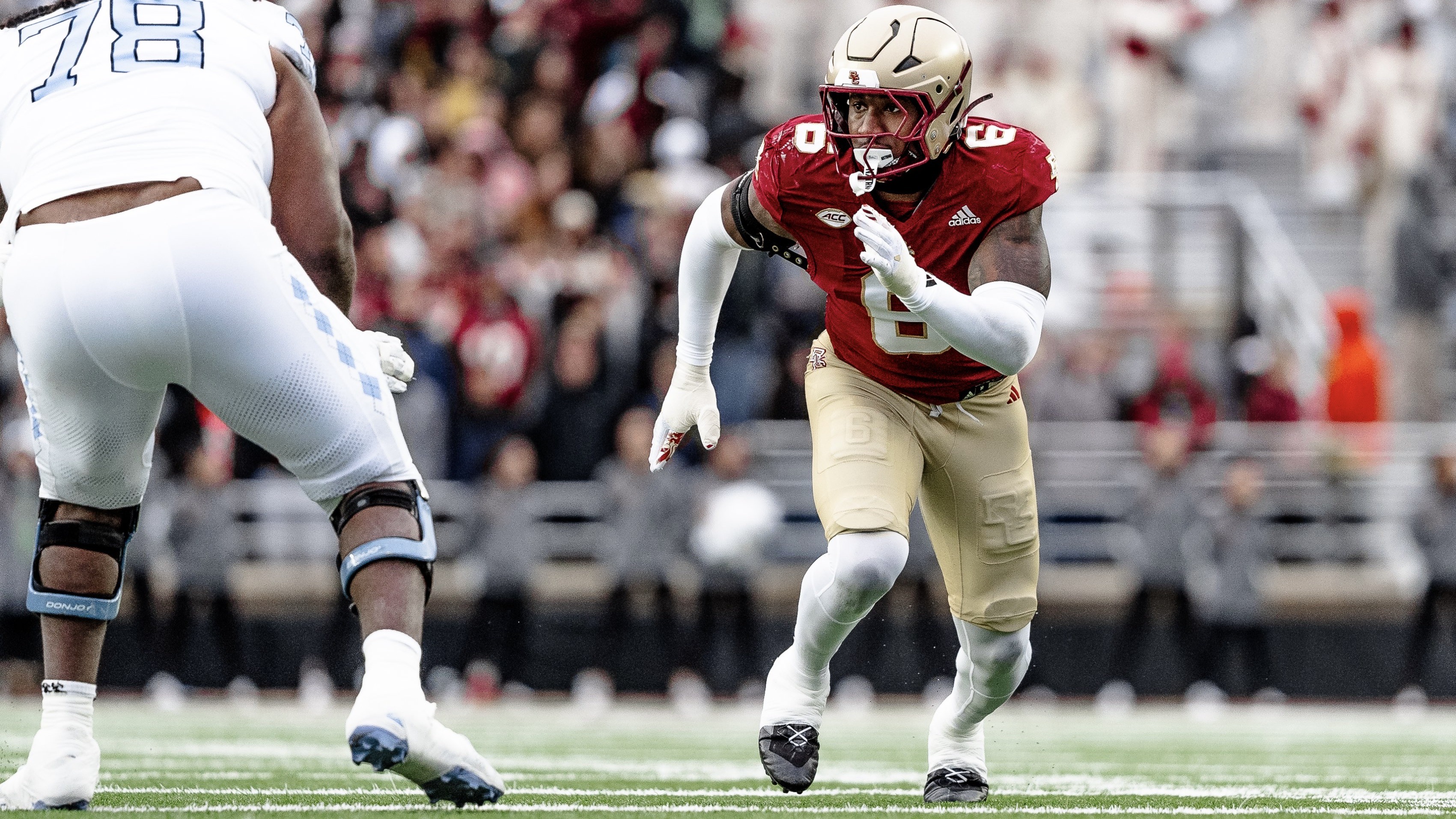 Donovan Ezeiruaku rushes the quarterback against North Carolina.