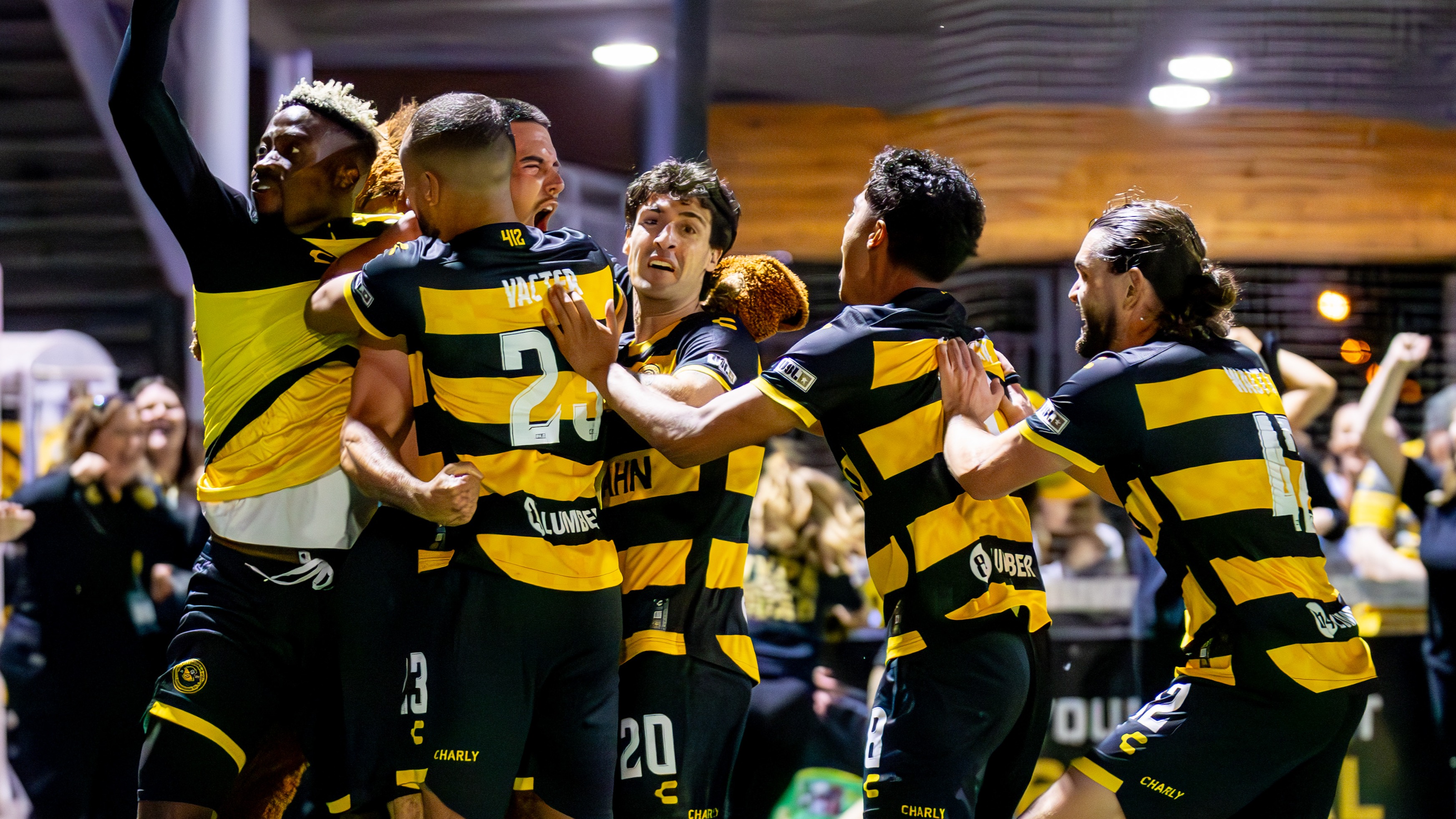 Riverhounds players mob Beto Ydrach after his late winner against New York City FC