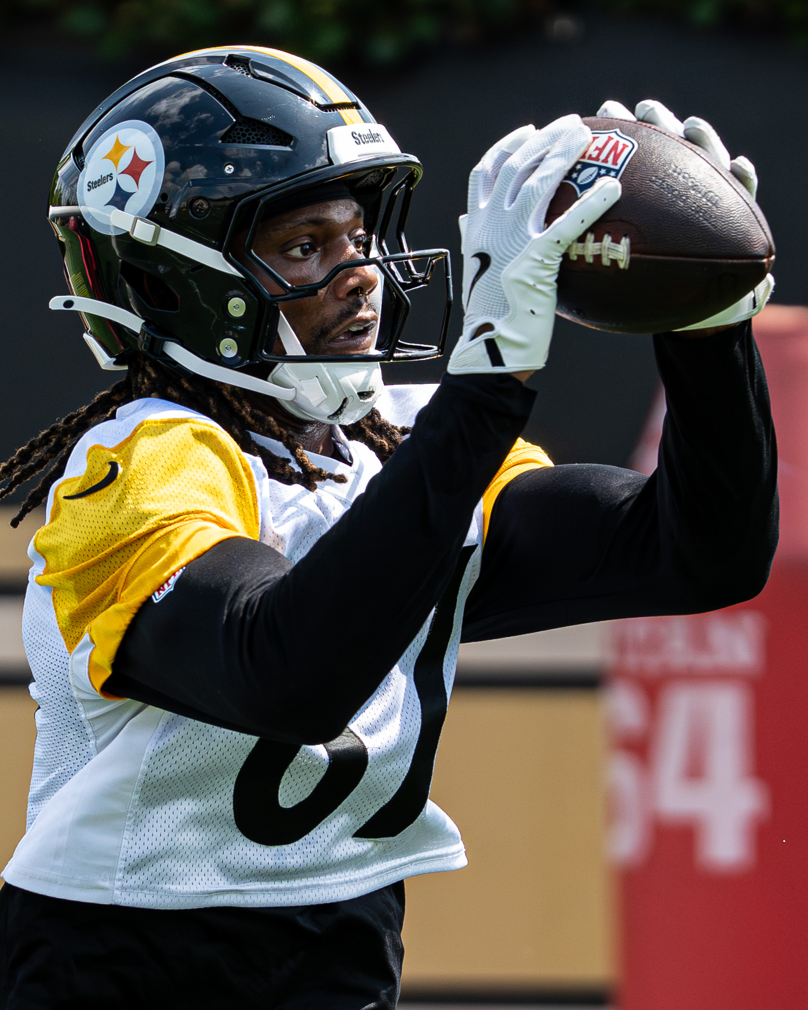 Brandon Smith catches a pass during a wide receiver drill on Thursday.