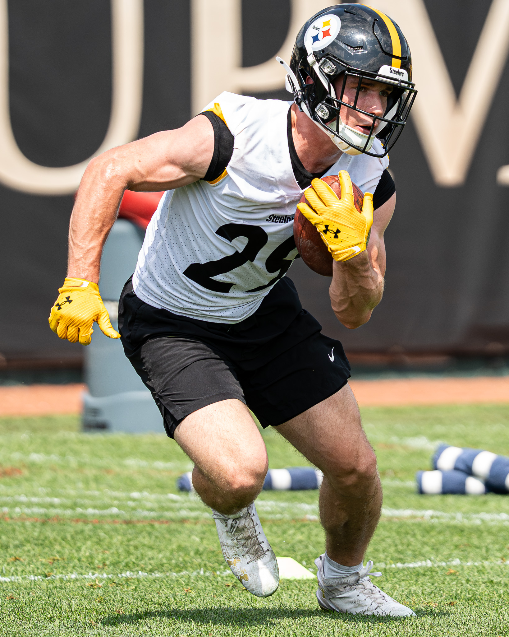 Eli Heidenreich cuts past a team staffer during a running backs drill. 
