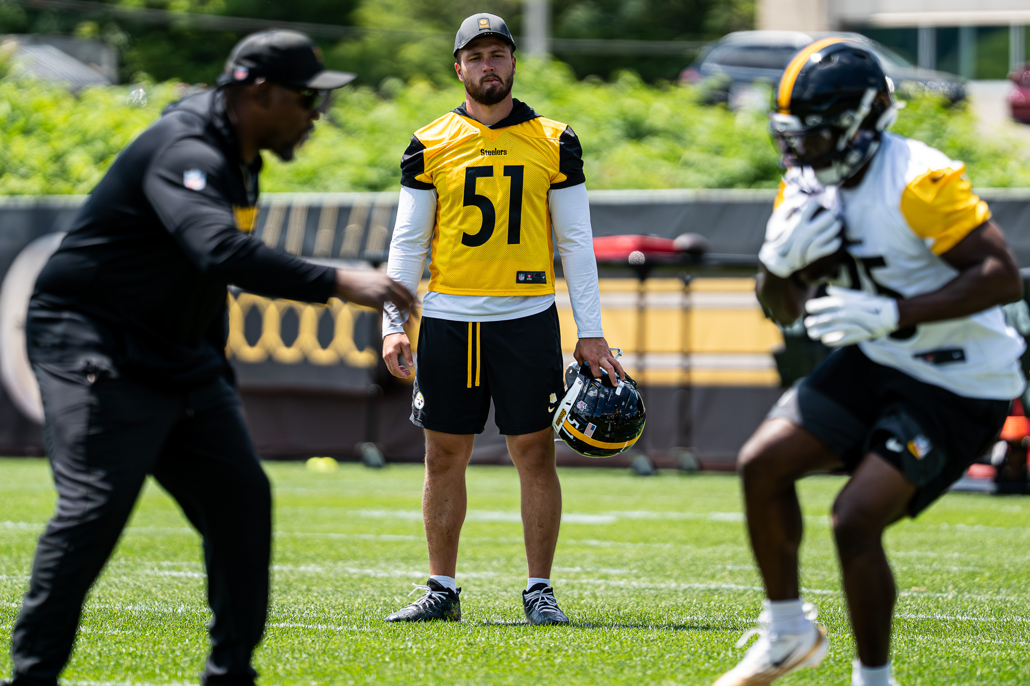 Nick Herbig, attending his first practice of the offseason, watches a drill from the side.