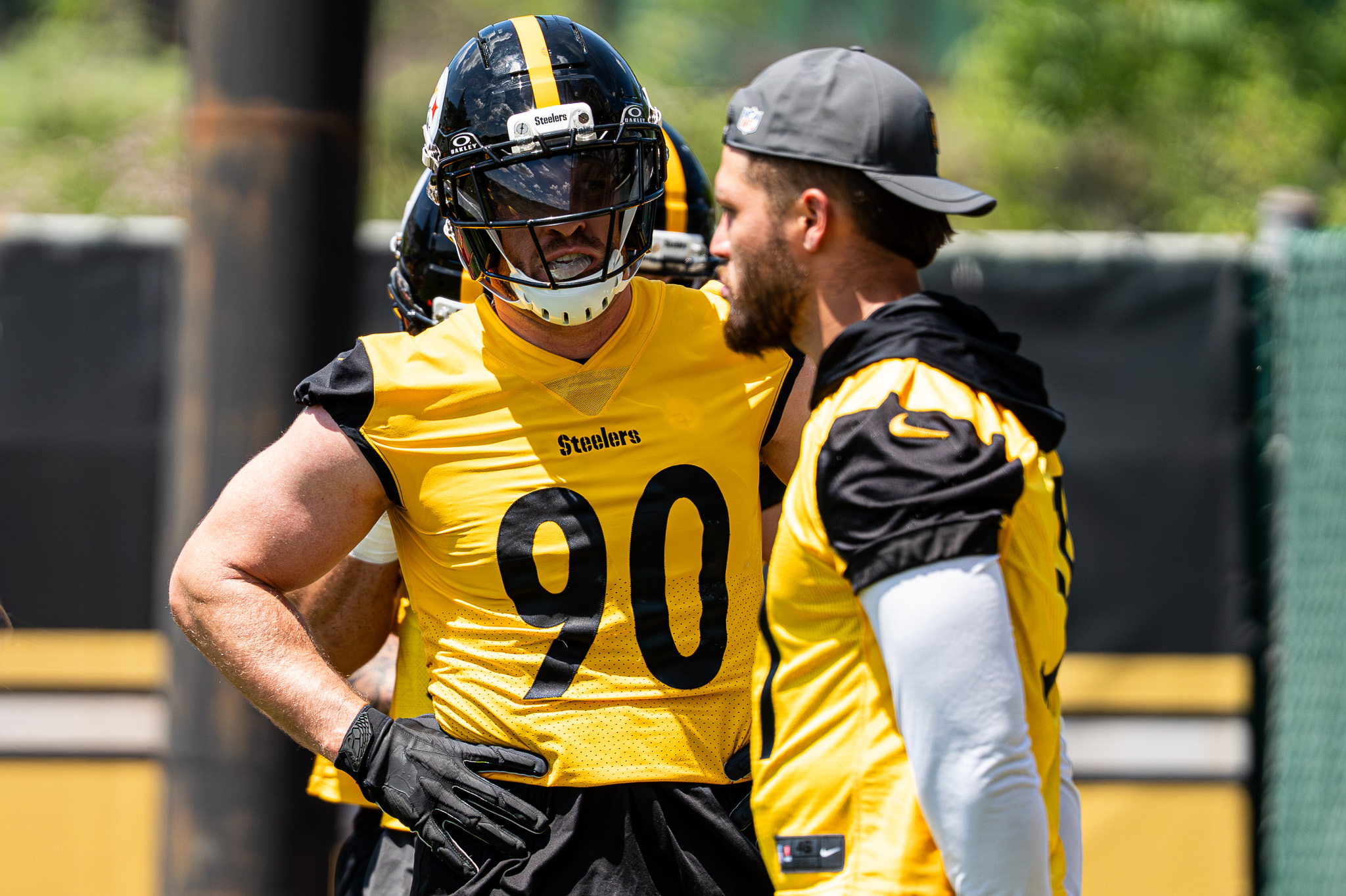 T.J. Watt talks with Nick Herbig during an outside linebackers drill. 