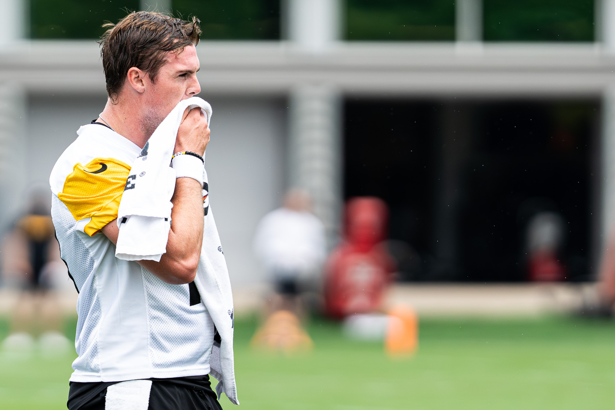 Will Howard wipes his face with a towel during Tuesday's practice. 