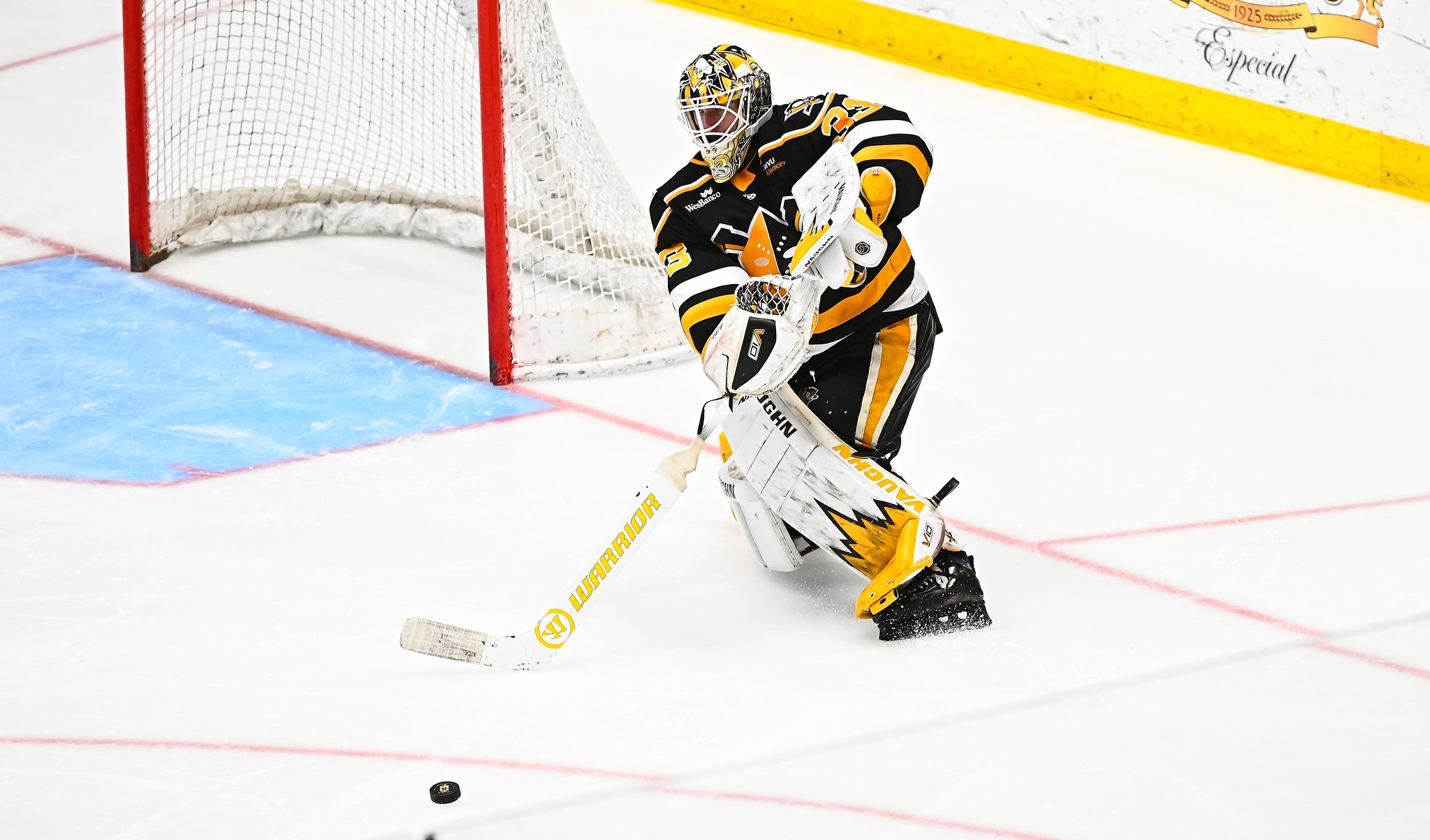 Taylor Gauthier plays the puck.