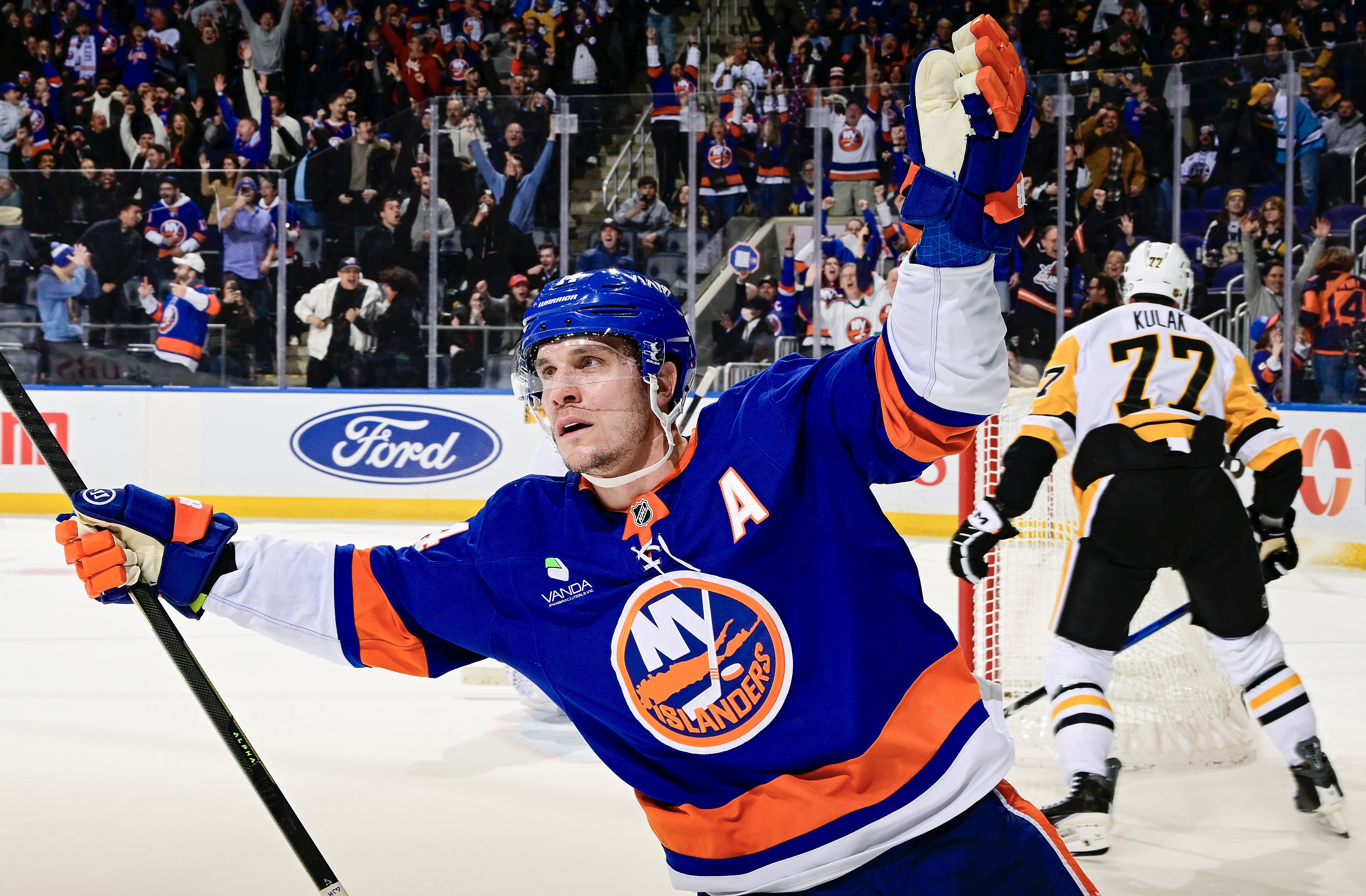 Bo Horvat celebrates his overtime goal against the Penguins Tuesday night in Elmont, N.Y.