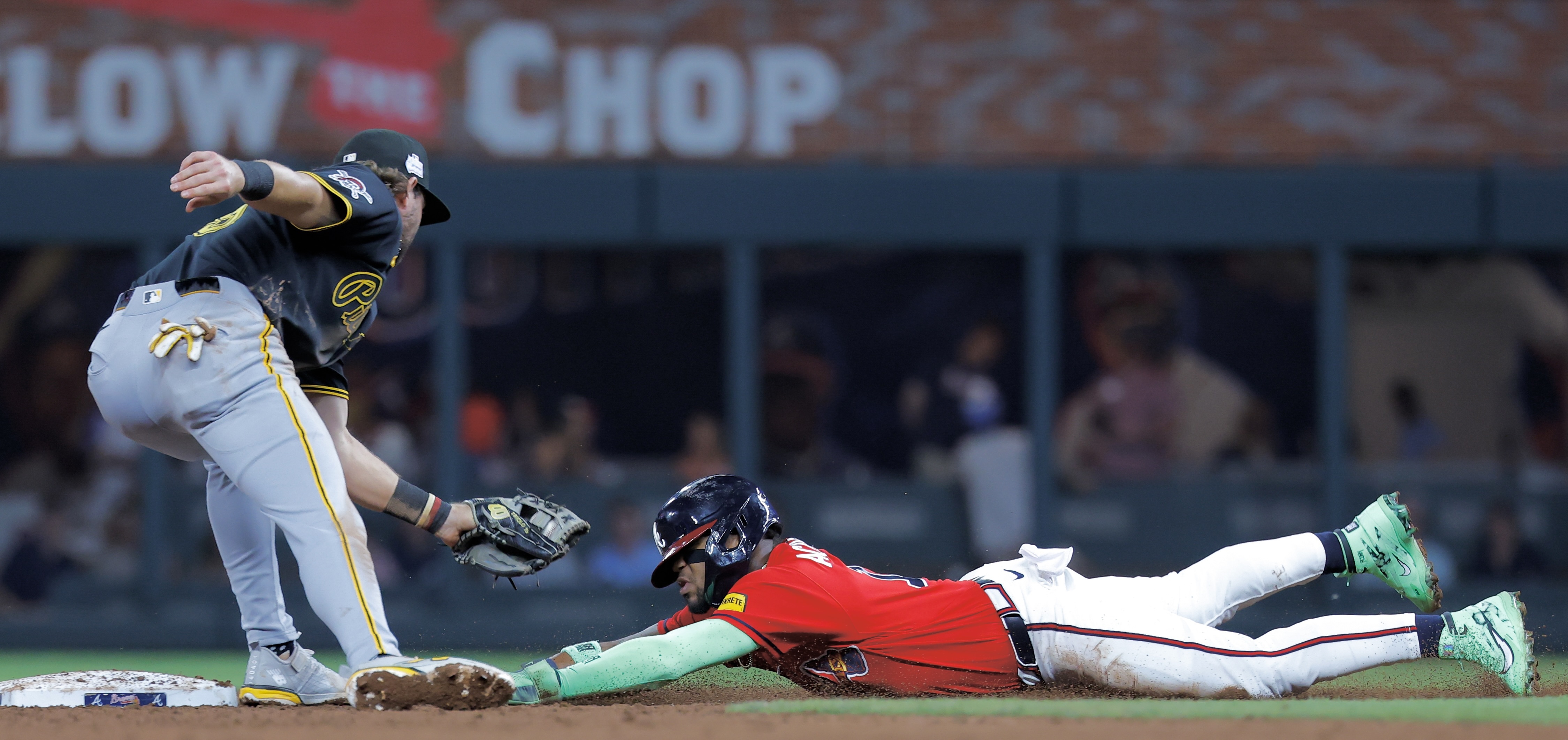 Jared Triolo tags out the Braves' Ronald Acuña trying to steal in the sixth inning Friday night in Atlanta.