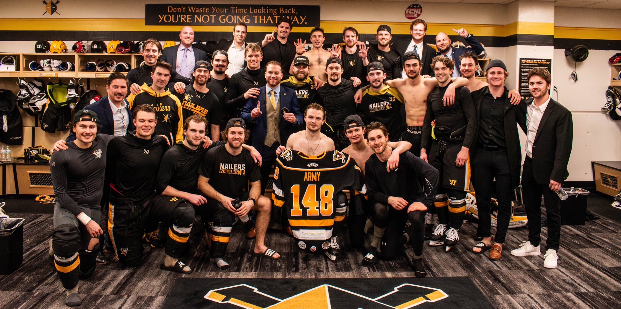 The Nailers celebrate Army's record 148th win behind the Nailers' bench.