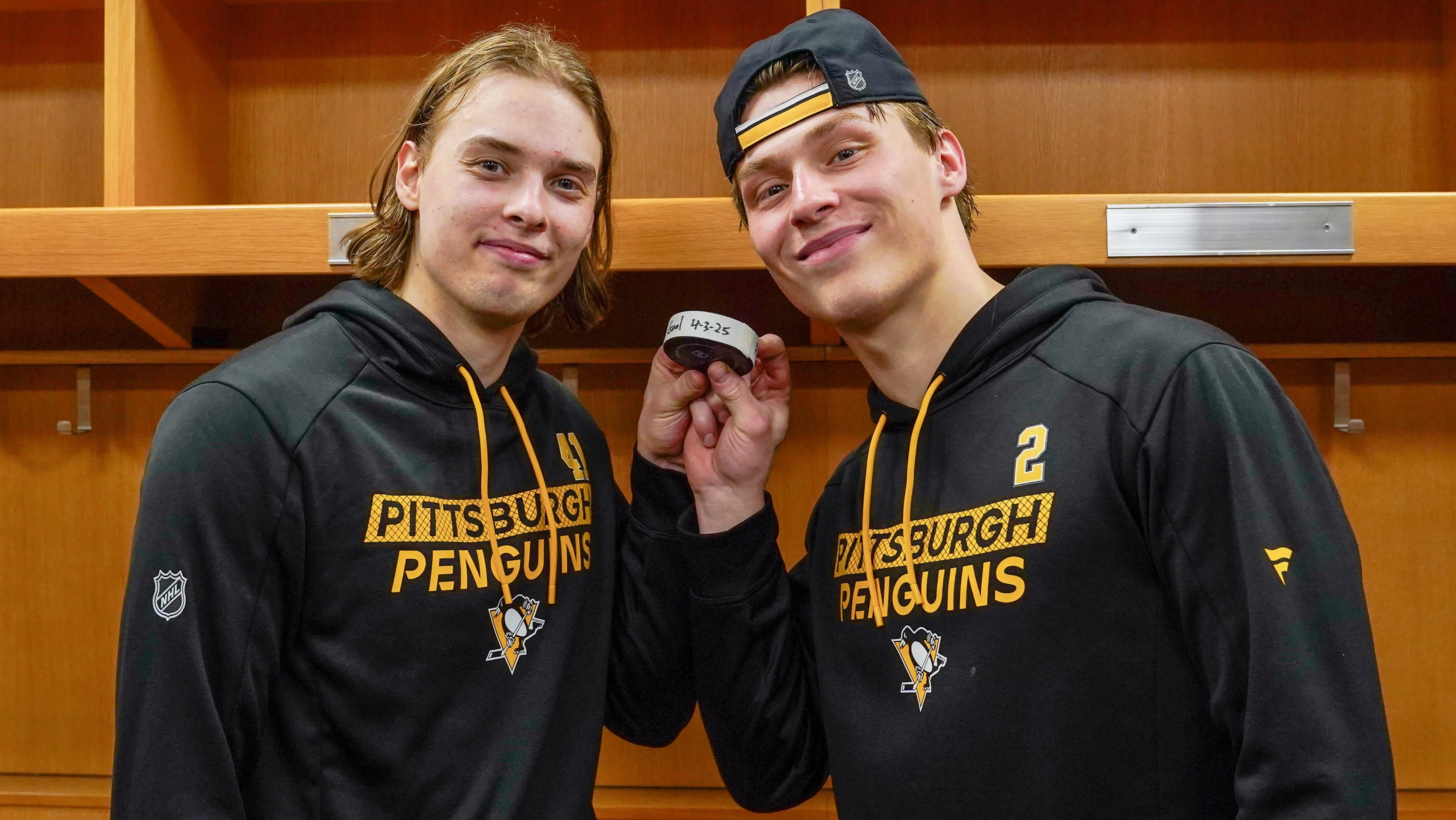Ville Koivunen, Rutger McGroarty with their shared puck in St. Louis on Thursday.