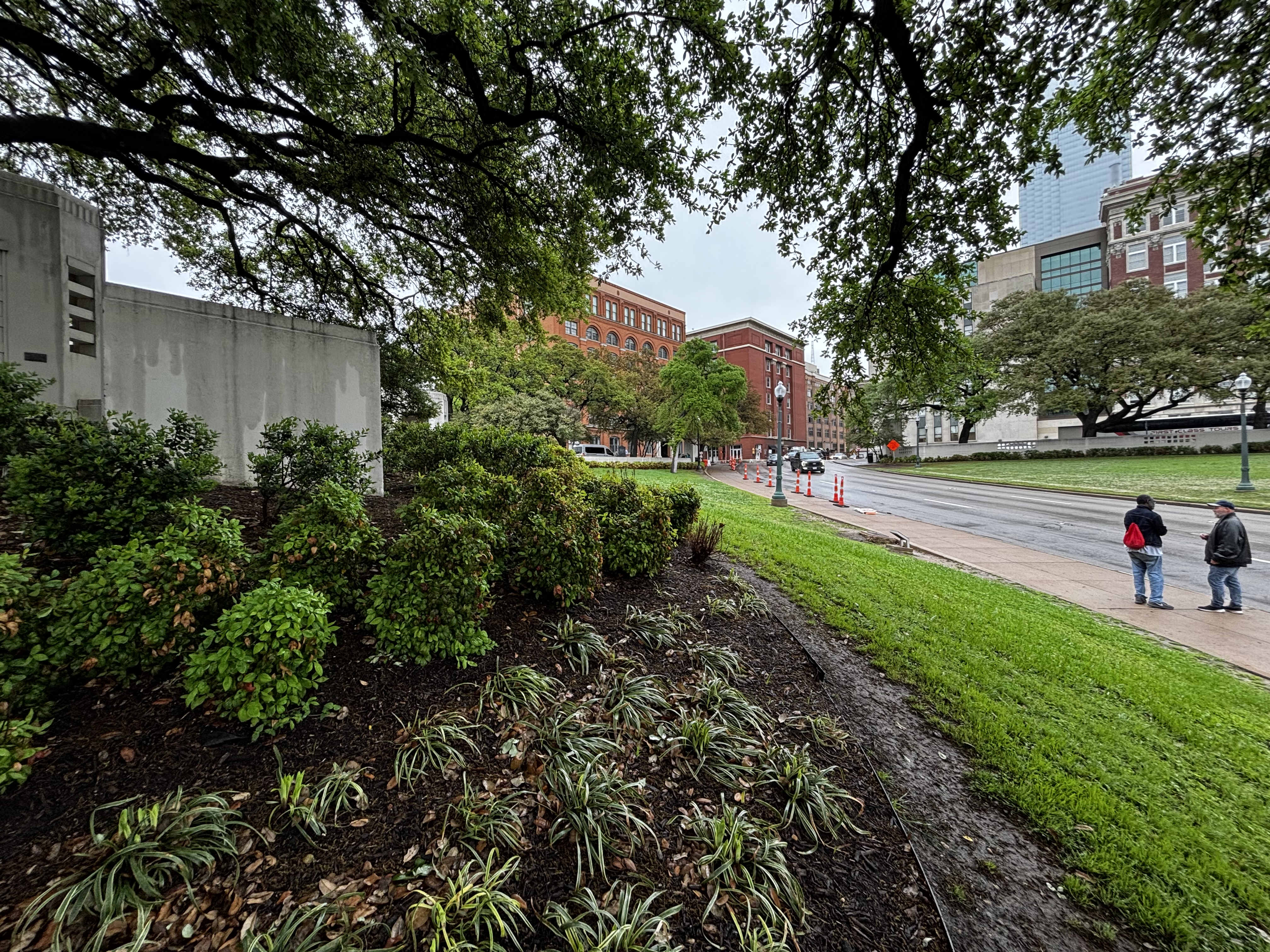 Dealey Plaza, with the Texas School Book Depository building in the distance.