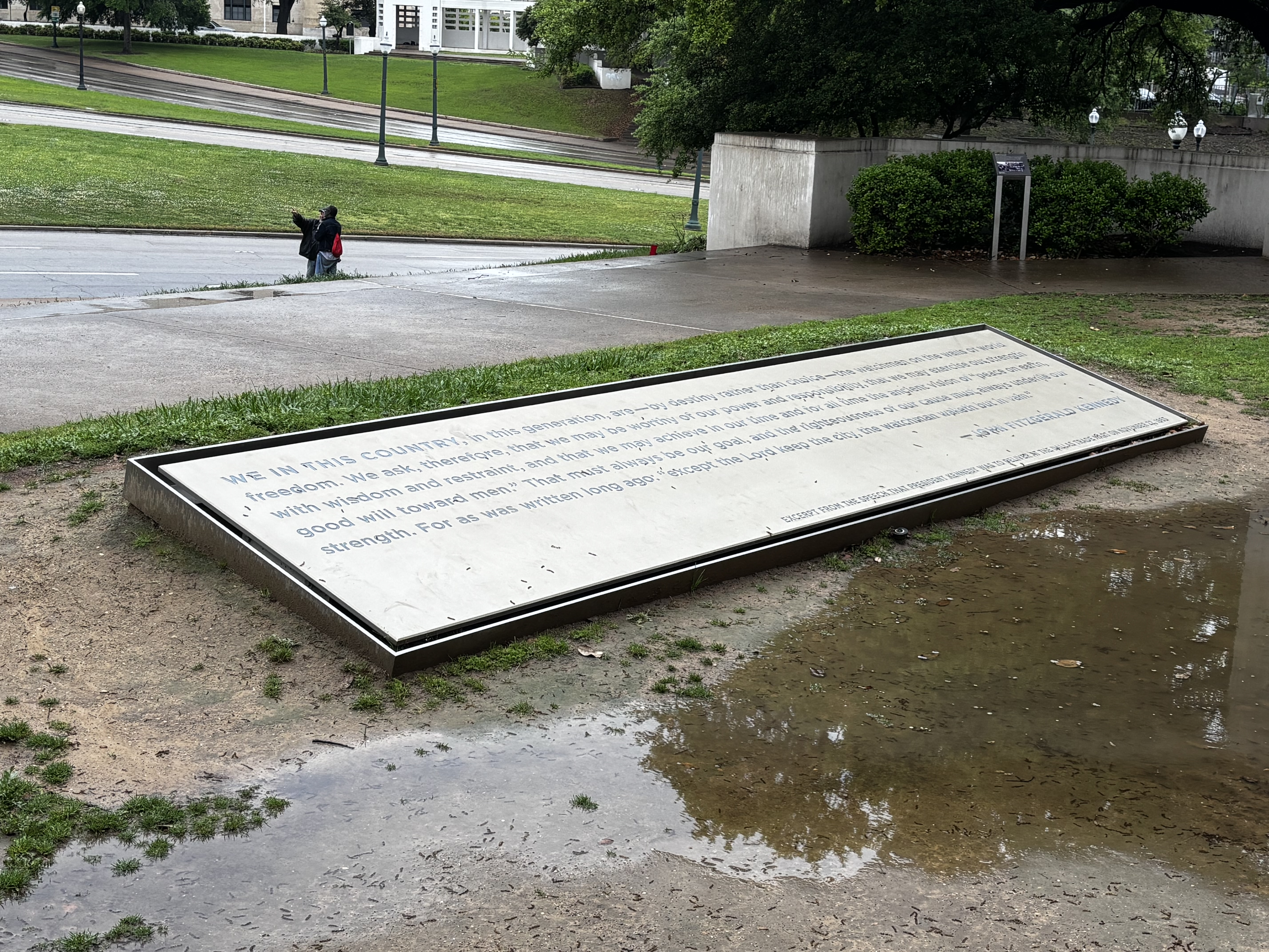A memorial quoting from the speech Kennedy was supposed to give in Dallas after the parade.