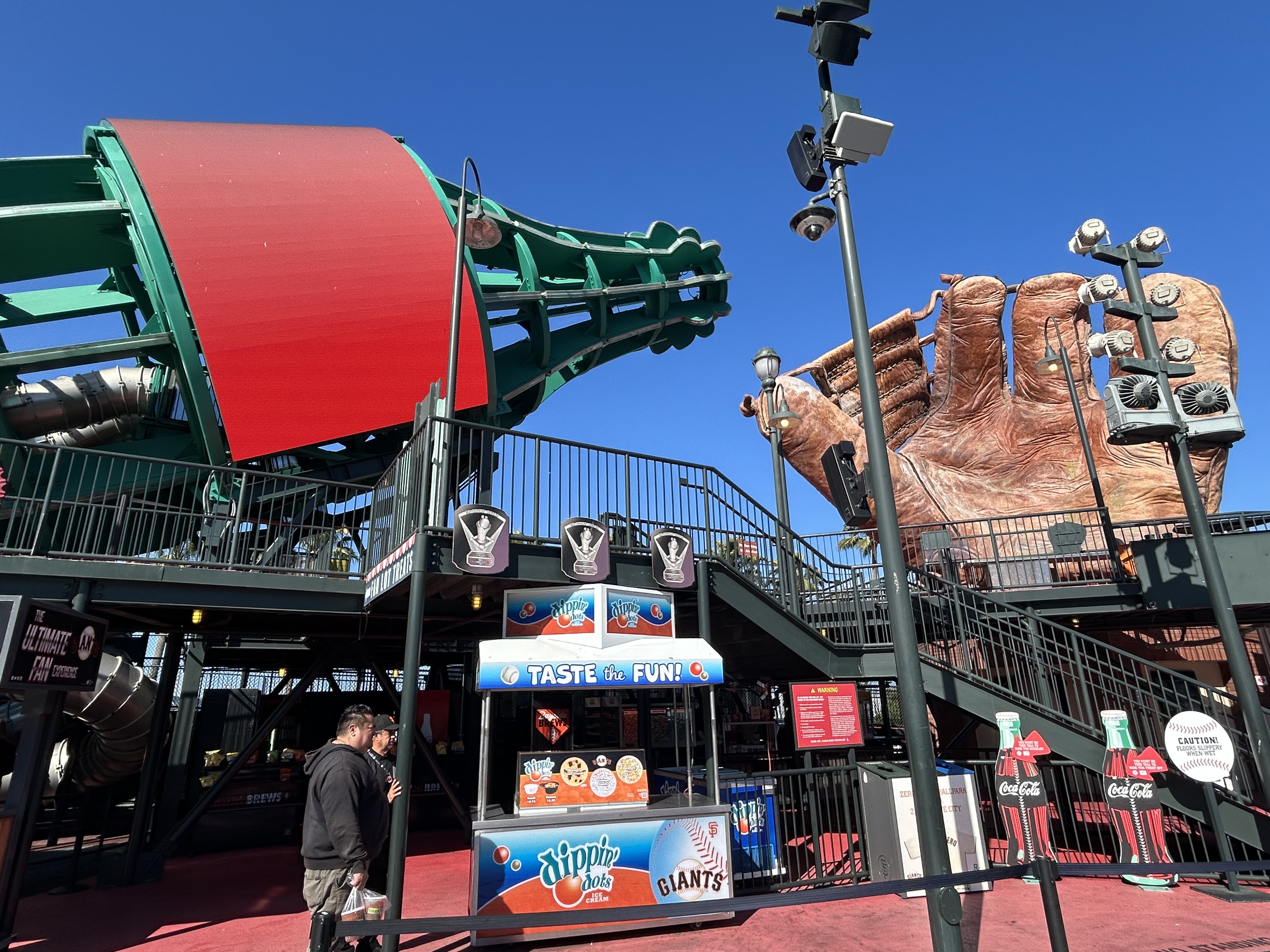 Coca Cola bottle slide and glove monument beyond left field at Oracle Park.