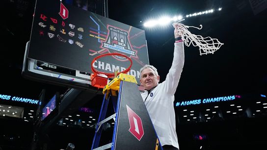 Keith Dambrot takes down the Atlantic 10 Conference championship net Sunday in New York. Keith Dambrot takes down the Atlantic 10 Conference championship net Sunday in New York.
