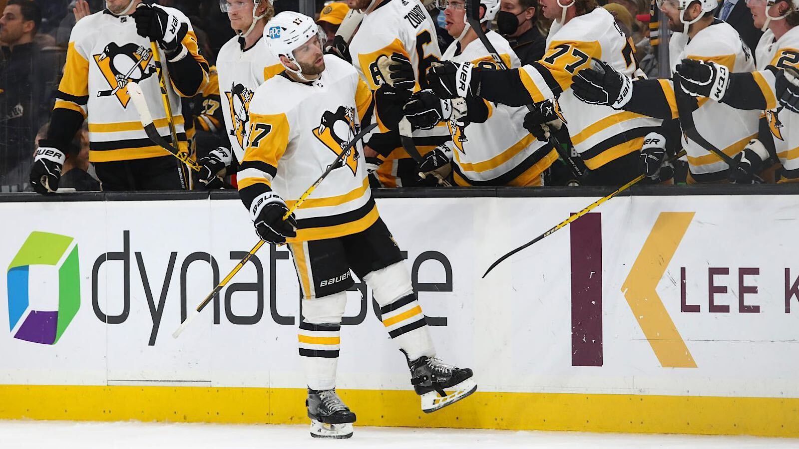 Pittsburgh Penguins' Dominik Simon, left, celebrates a goal by