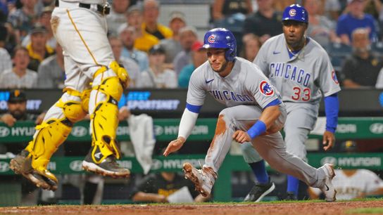 Nick Madrigal slides home for a run in the seventh inning Monday