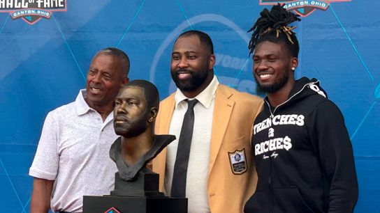M.J. Devonshire, right, poses with Tony Dorsett, left, and Darrelle Revis during Revis' enshrinement into the Pro Football Hall of Fame last year in Canton, Ohio. M.J. Devonshire, right, poses with Tony Dorsett, left, and Darrelle Revis during Revis' enshrinement into the Pro Football Hall of Fame last year in Canton, Ohio.