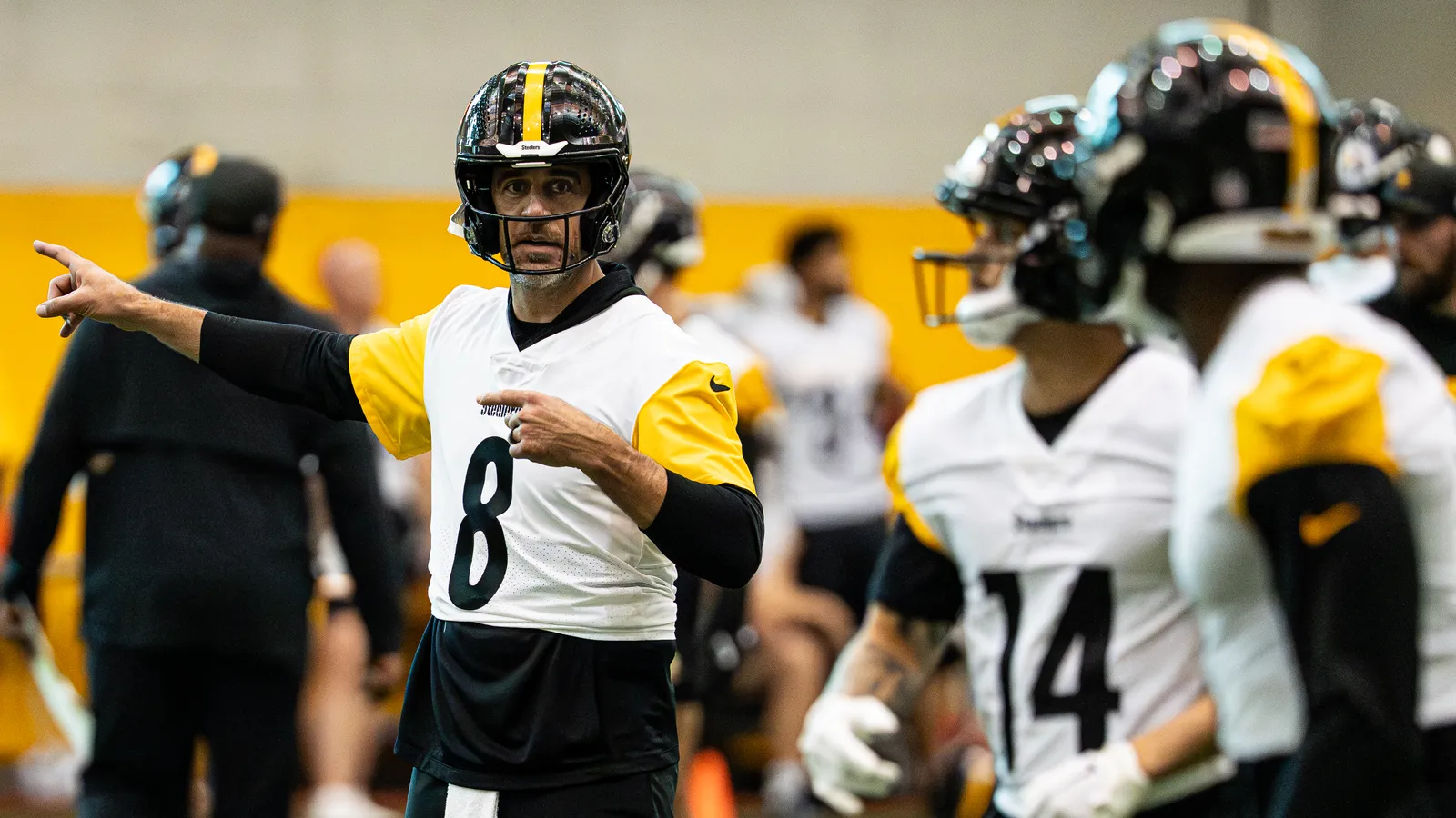 Aaron Rodgers puts Roman Wilson in motion.