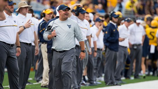 Transfers embraced by West Virginia D-line taken in Morgantown, W.Va. (zColumns)