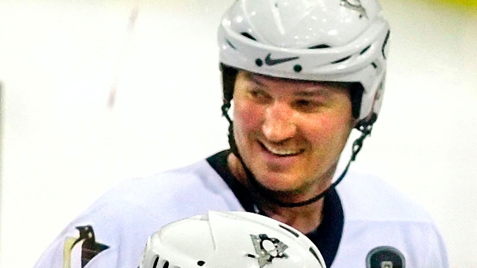 Mario Lemieux of the Pittsburgh Penguins skates with the puck as