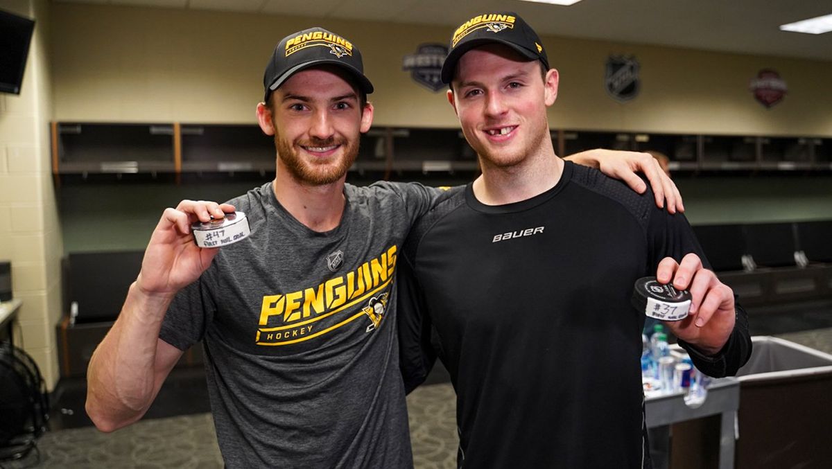 Adam Johnson and Sam Lafferty with their first NHL goal pucks after each scoring in Minnesota Adam Johnson and Sam Lafferty with their first NHL goal pucks after each scoring in Minnesota