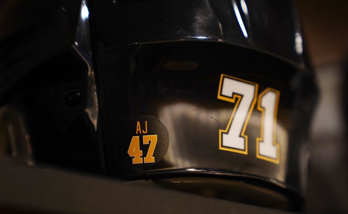 The sticker remembering Adam Johnson on the back of Evgeni Malkin's helmet on Monday. The sticker remembering Adam Johnson on the back of Evgeni Malkin's helmet on Monday.