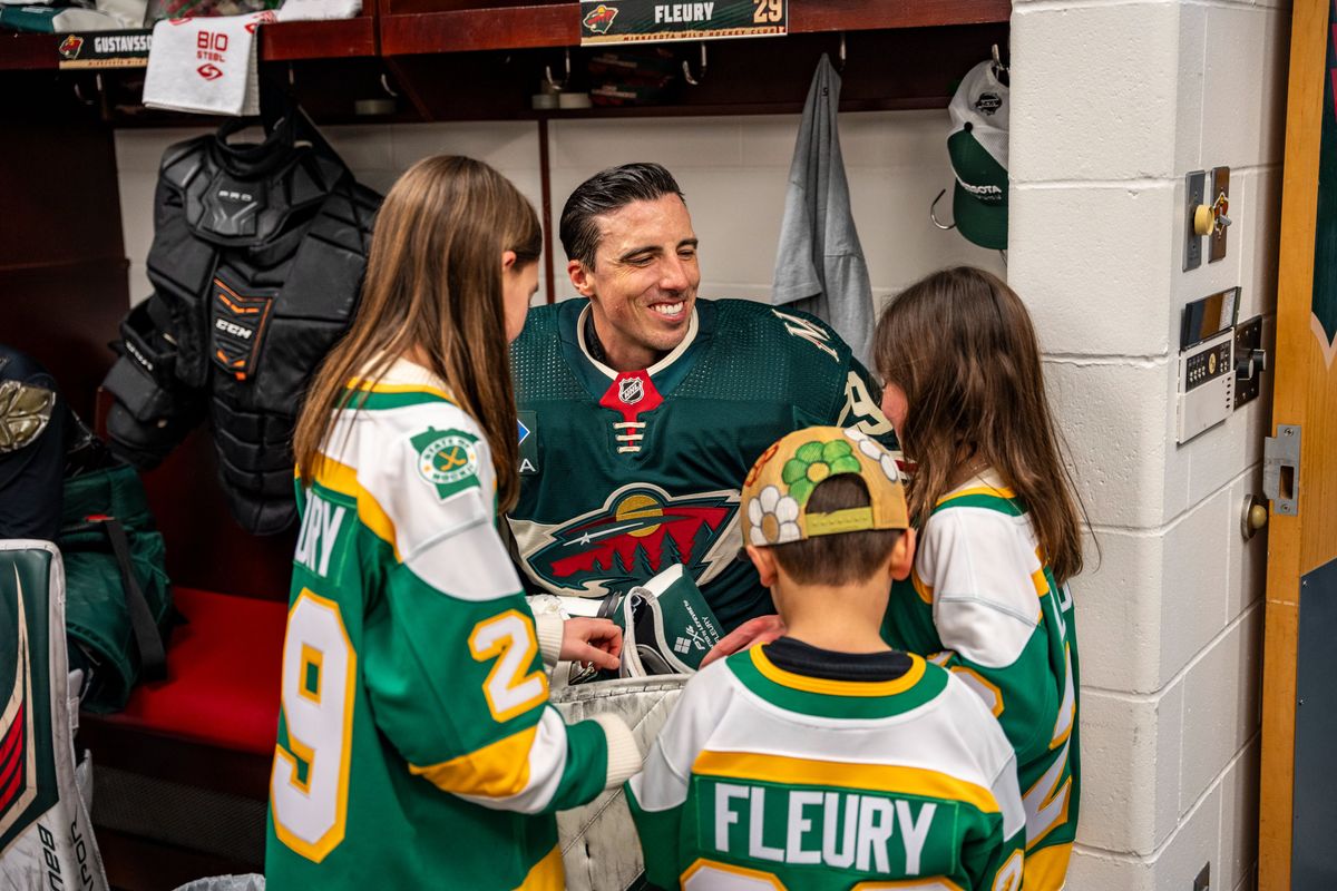 Marc-Andre Fleury with his children in the Wild's locker room before Friday's game. Marc-Andre Fleury with his children in the Wild's locker room before Friday's game.