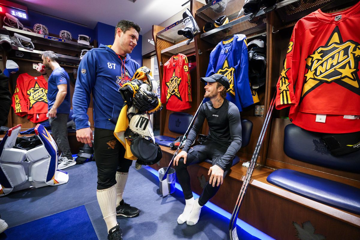 Justin Bieber smiles at Sidney Crosby in the locker room on Saturday. Justin Bieber smiles at Sidney Crosby in the locker room on Saturday.